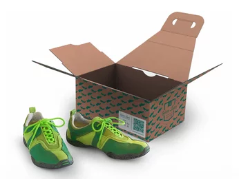 Carrier bag made of corrugated cardboard with shoes in front of it Carrier bag made of corrugated cardboard with shoes in front of it